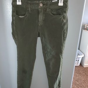green skinny jeans
